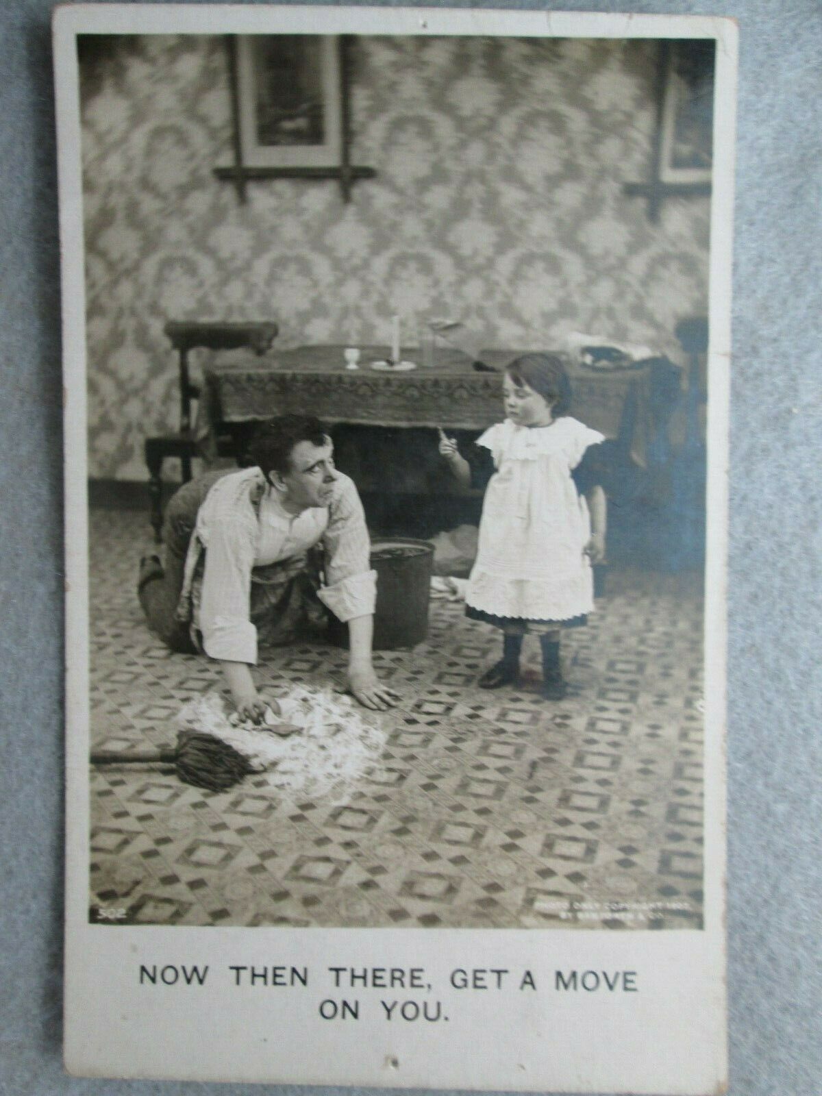 Now There, Get A Move On, Little Girl Scolds Dad Scrubbing Floor Postcard 1907