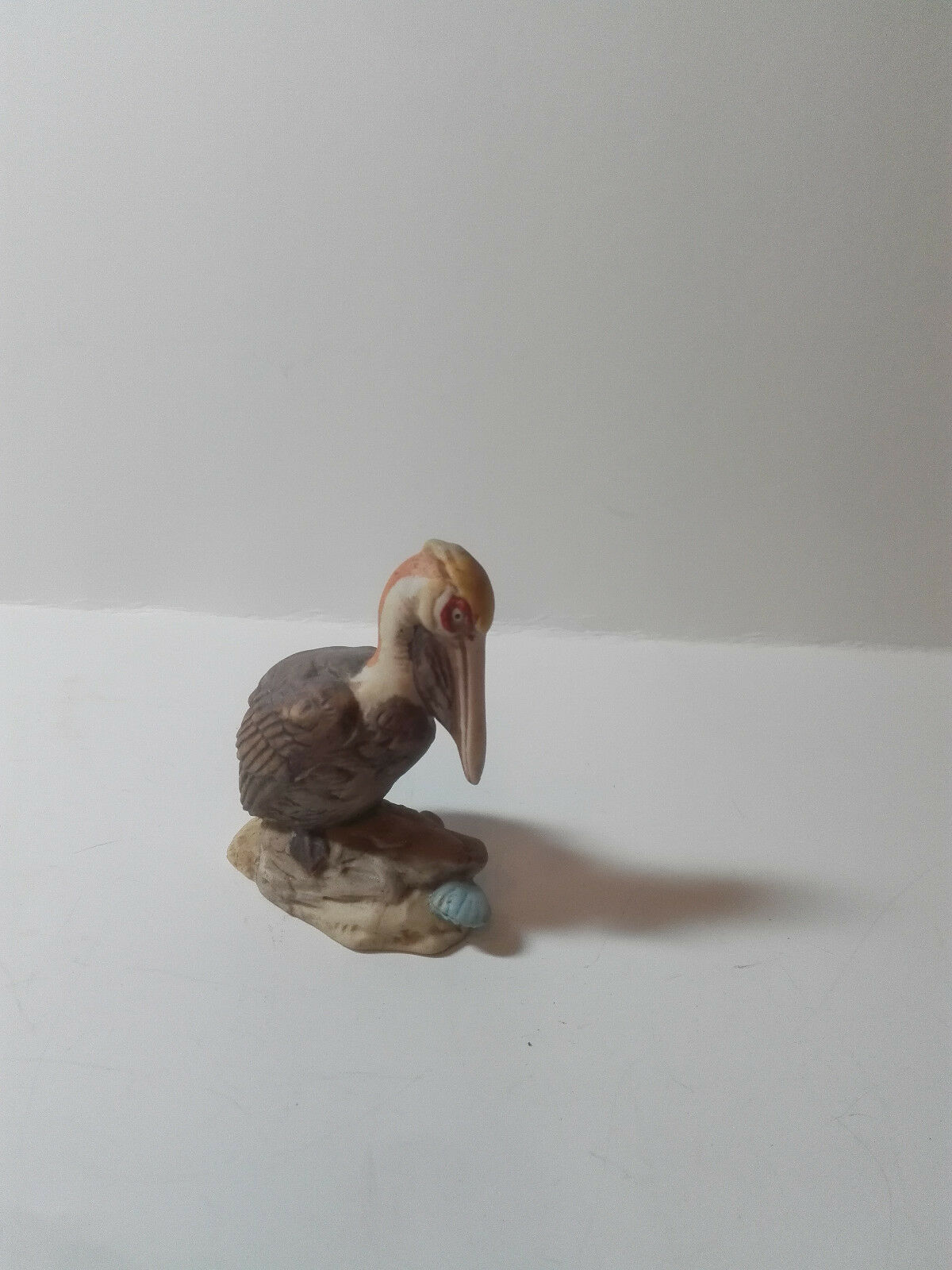 Ceramic Coastal Bird Pelican Figurine Perched Upon Rock Overtop Of Clam Shell